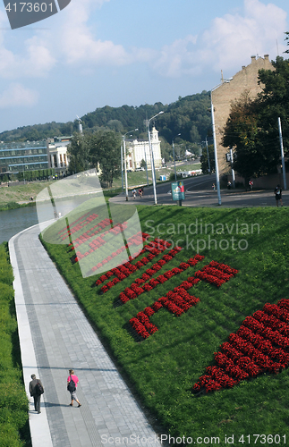 Image of editorial Neris river with pedestrian walkway and bicycle path i