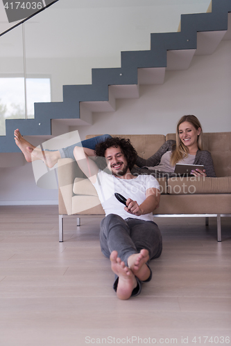 Image of young couple relaxes in the living room