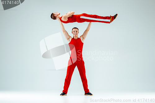 Image of The two gymnastic acrobatic caucasian men on balance pose