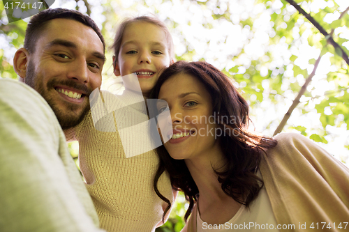 Image of happy family in summer park