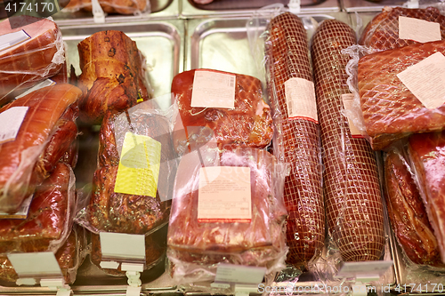 Image of ham at grocery store stall