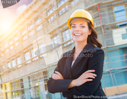 Image of Portrait of Female Contractor Wearing Hard Hat at Construction S