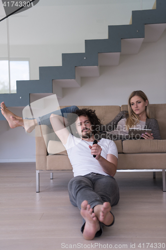 Image of young couple relaxes in the living room