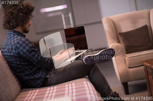 Image of man working with laptop