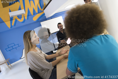 Image of Multiethnic startup business team on meeting