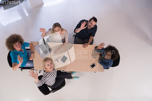 Image of Multiethnic startup business team on meeting  top view