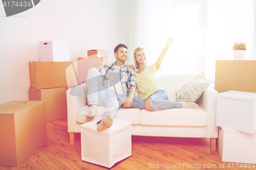 Image of couple with boxes moving to new home and dreaming