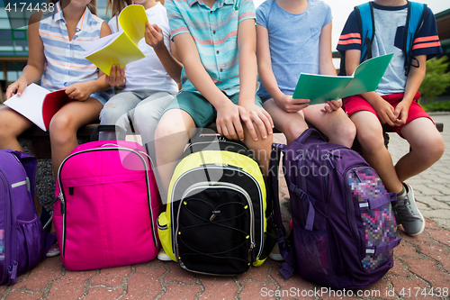 Image of students with school backpacks and notebooks