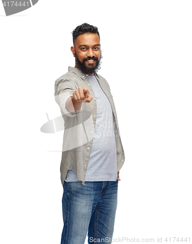 Image of happy smiling indian man pointing finger to you