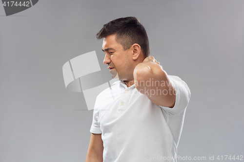 Image of unhappy man suffering from neck pain