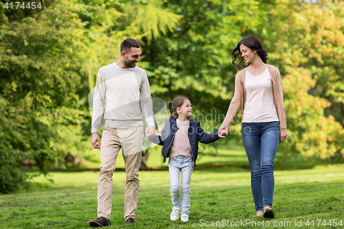 Image of happy family walking in summer park