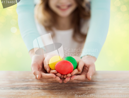 Image of close up of happy family holding easter eggs