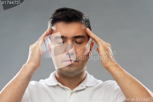 Image of man suffering from head ache or thinking