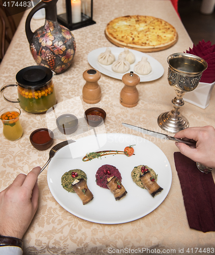 Image of Man eating in georgian restaurant