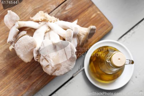 Image of Oyster mushrooms mushrooms and olive oil.