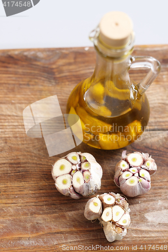 Image of Olive garlic. Olive oil with garlic cloves.