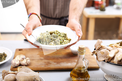 Image of Green diet. The cook prepares the dish.