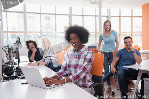 Image of African American informal business woman working in the office