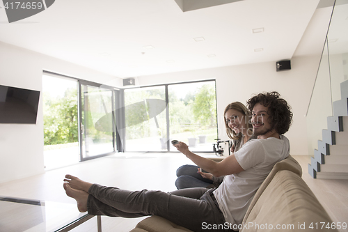 Image of young couple relaxes in the living room