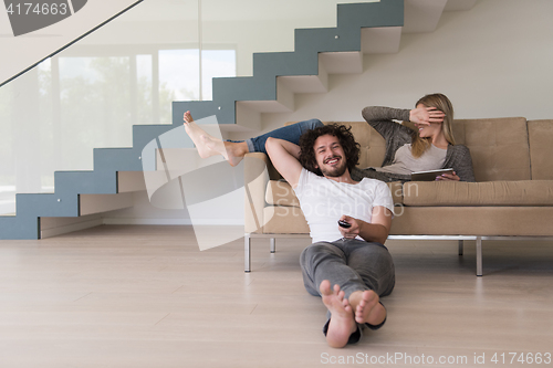 Image of young couple relaxes in the living room