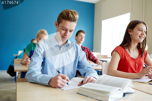 Image of group of students with books at school lesson