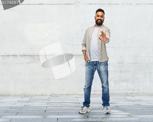 Image of happy smiling indian man showing ok hand sign