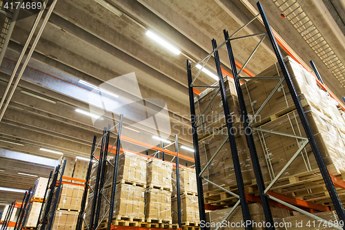 Image of cargo boxes storing at warehouse shelves