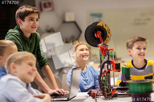 Image of happy children with 3d printer at robotics school