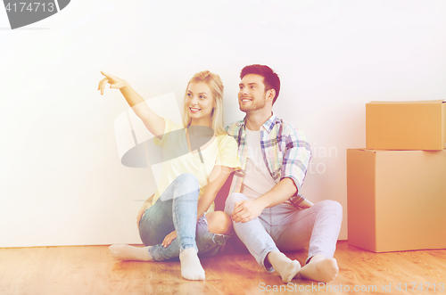 Image of couple with boxes moving to new home and dreaming