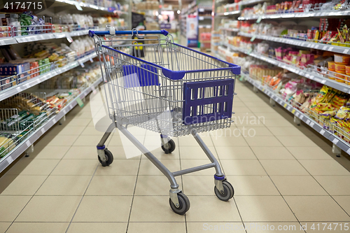 Image of empty shopping cart or trolley at supermarket