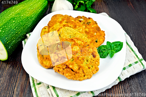 Image of Flapjack chickpeas with zucchini in plate on dark board
