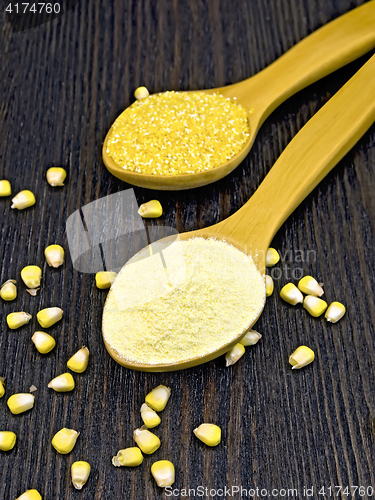 Image of Flour and cereals corn in spoon on dark board