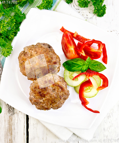 Image of Cutlets stuffed with basil in plate on board top