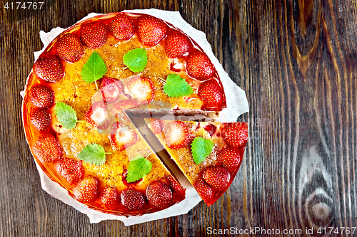 Image of Pie strawberry with jelly on dark board top