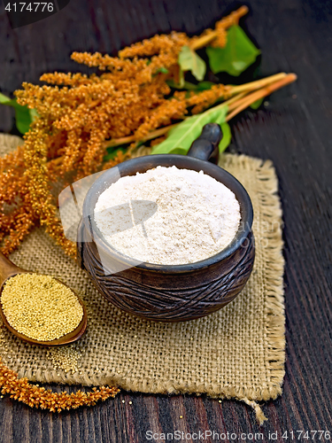 Image of Flour amaranth in clay cup with flower on sackcloth