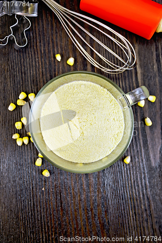 Image of Flour corn in glass cup on board top