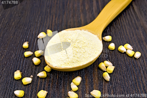 Image of Flour corn in spoon on dark board