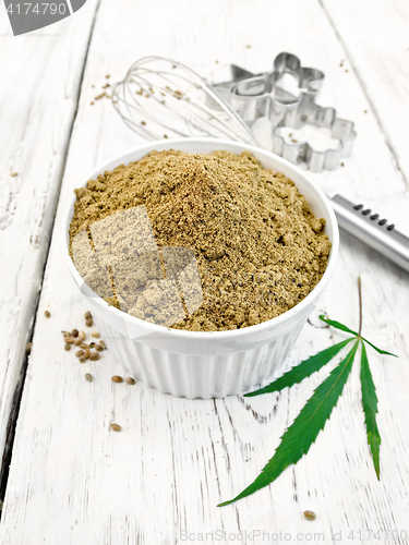 Image of Flour hemp in bowl with leaf on board