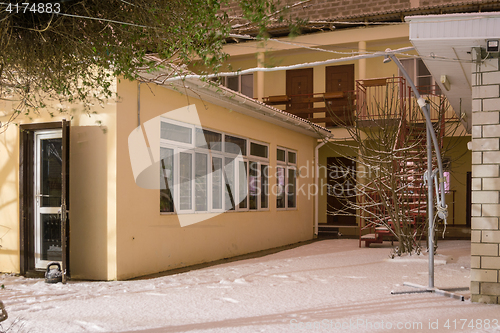 Image of Type in the winter on a small two-story guest house
