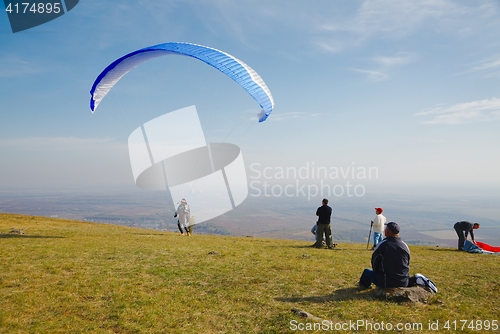 Image of Paraglider preparing for takeoff