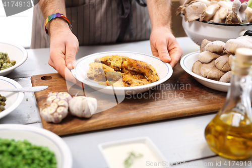 Image of Oyster topped with bread crumbs a puree of green peas