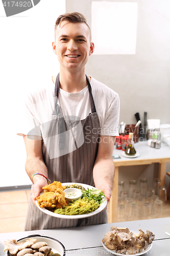 Image of Vegan dish. The cook prepares a dish dinner. 