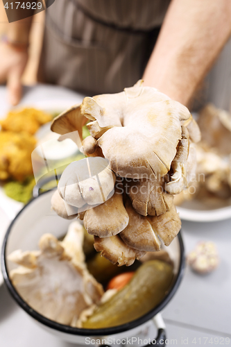 Image of Oyster mushrooms mushrooms and olive oil.