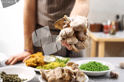 Image of Oyster mushrooms mushrooms and olive oil.