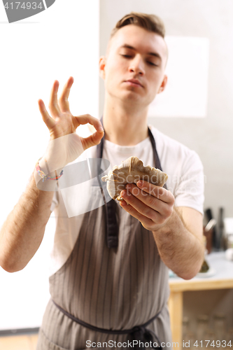 Image of Cook in a restaurant kitchen 