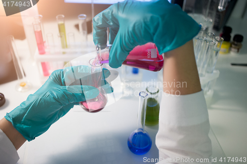 Image of Lab assistant carries chemical testing