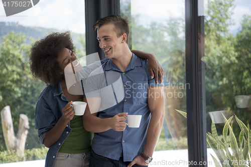 Image of romantic happy young couple relax at modern home indoors