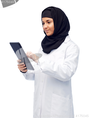 Image of muslim female doctor in hijab with tablet pc