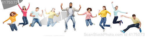 Image of international group of happy people jumping