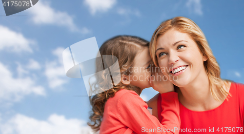 Image of happy mother and girl whispering into ear